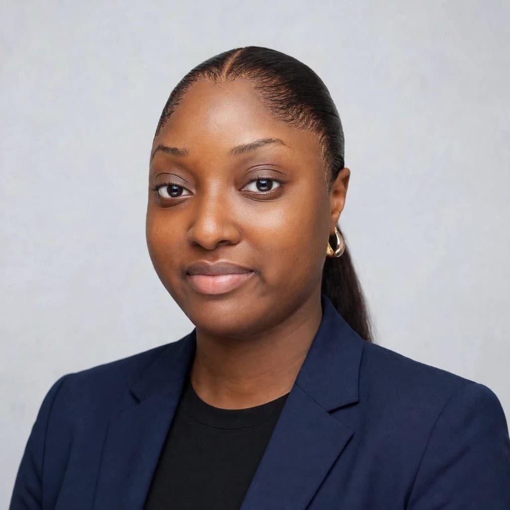 Akinpelu Oluwabusolami Janet, founder of CT Events, in a navy blazer against a pale grey background